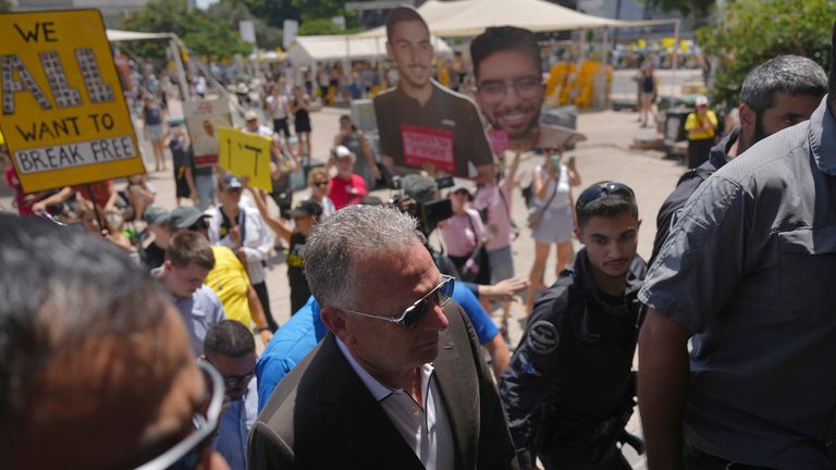 Steve Witkoff, front centre, arrives to meet families of hostages in Tel Aviv, Israel. Pic: AP/Ariel Schalit
