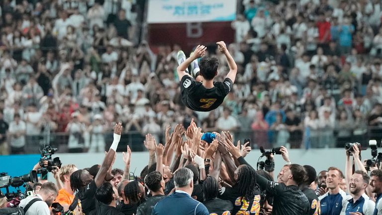 Tottenham Hotspur's Heung-Min Son is tossed in the air by team-mates after the game against Newcastle United in Seoul