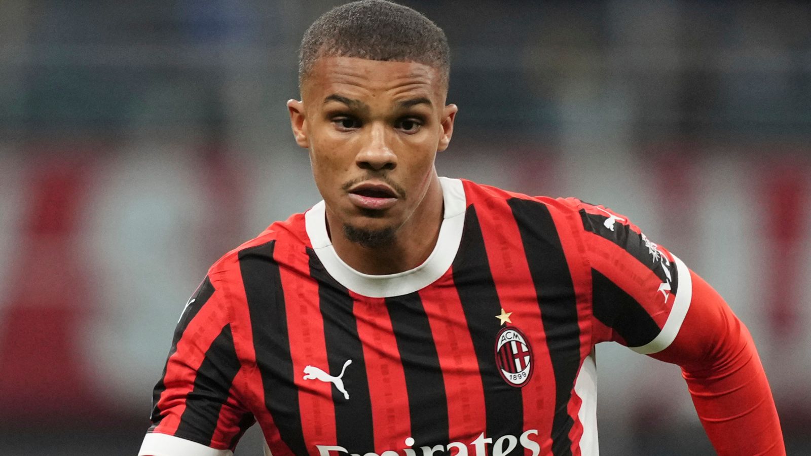 AC Milan's Malick Thiaw runs during the Serie A soccer match between AC Milan and Juventus at the San Siro stadium, in Milan, Italy, Saturday, Nov. 23, 2024. (AP Photo/Antonio Calanni)