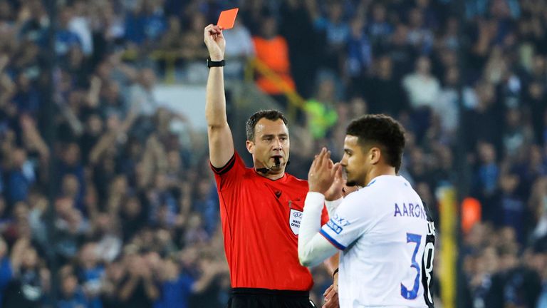 Rangers' Max Aarons is shown a red card during the Champions League play-off second leg against Club Brugge