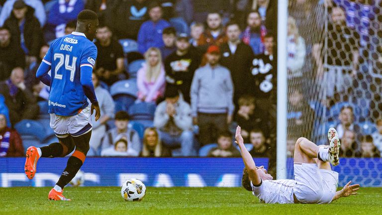 Rangers' Nasser Djiga (L) fouls Dundee's Finlay Robertson before being sent off f