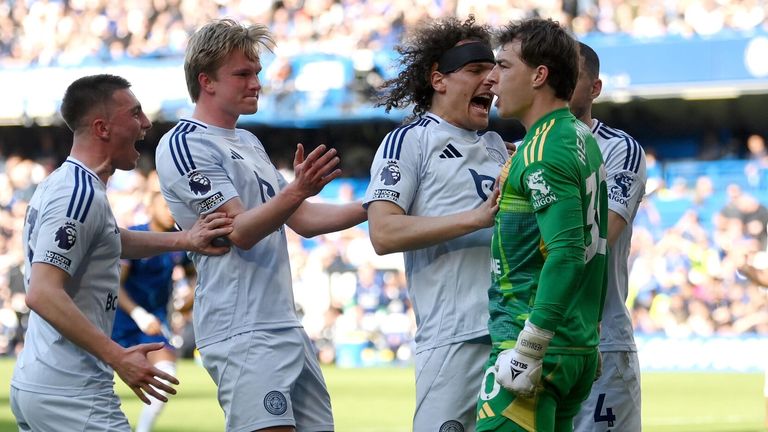 Mads Hermansen is mobbed by his team-mates after saving Cole Palmer's penalty