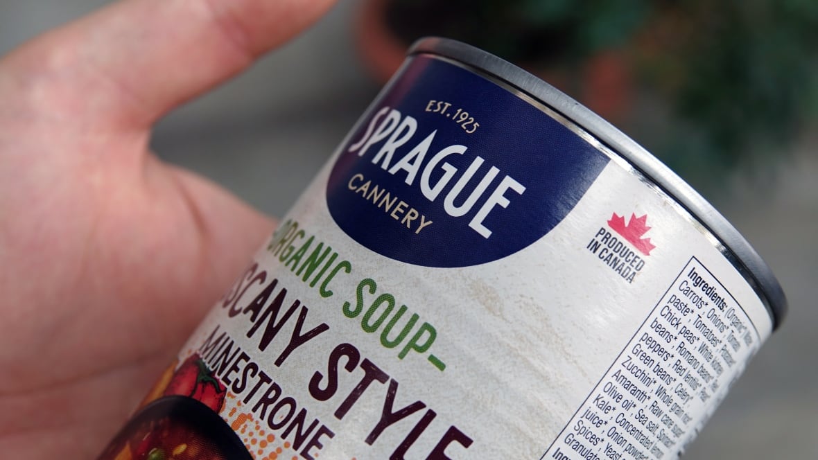 A closeup image of a can of Minestrone soup with a red maple leaf on its side, next to the list of ingredients.
