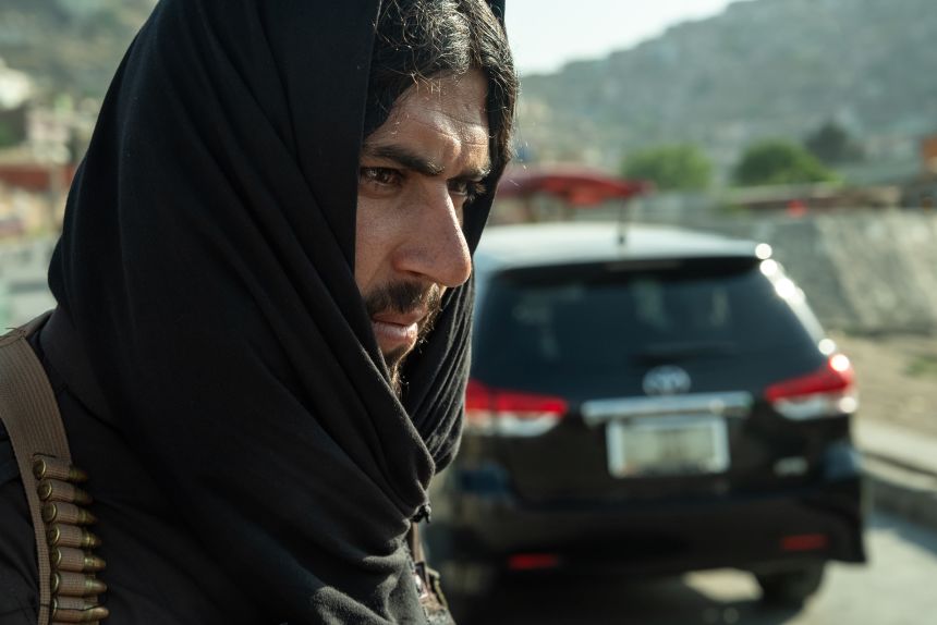 A Taliban security officer mans a checkpoint in Kabul, Afghanistan, in June.