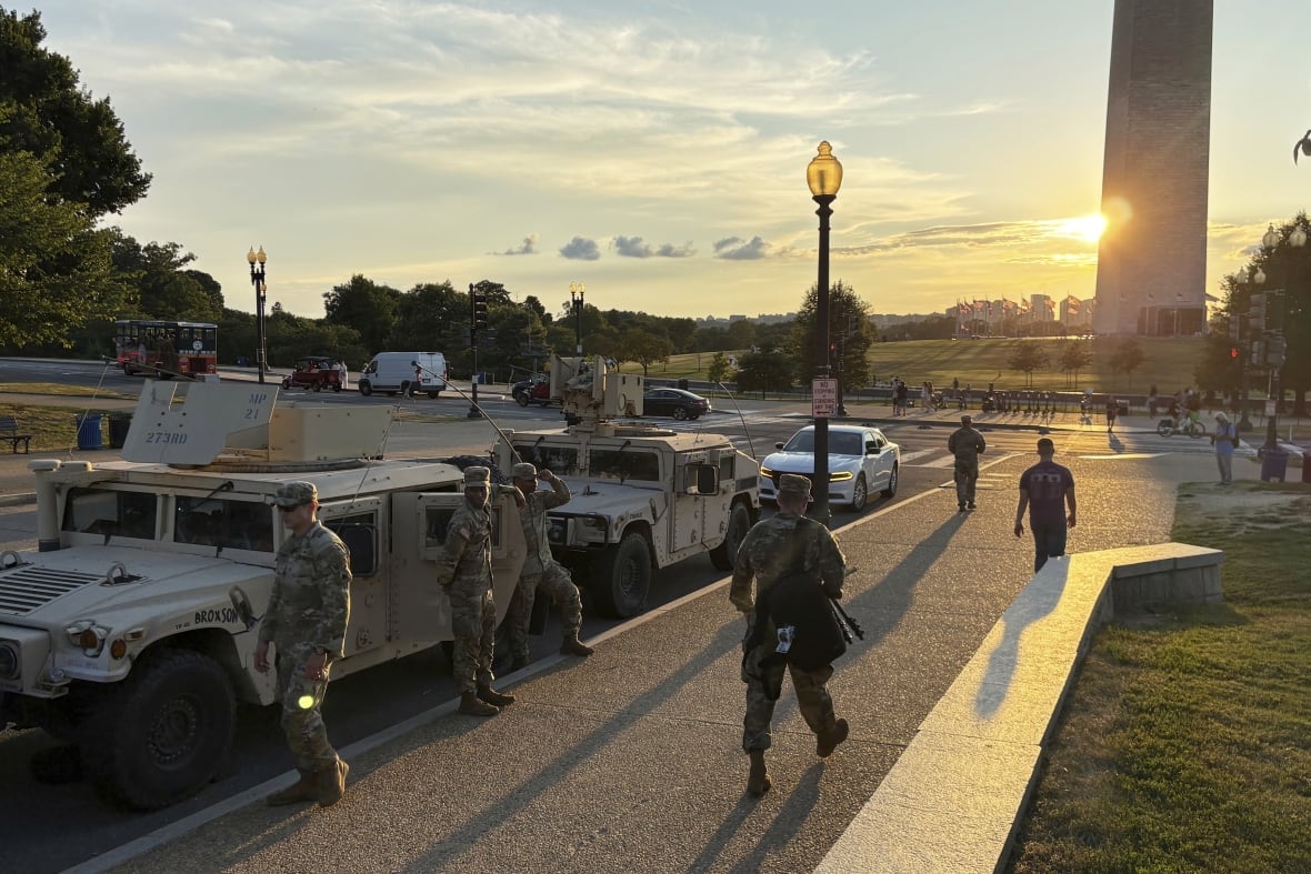 District of Columbia National Guard members park near the Washington Monument Tuesday, Aug. 12, 2025, in Washington.
