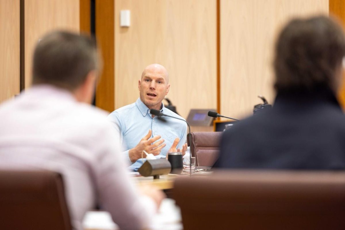 David Pocock questioning two men