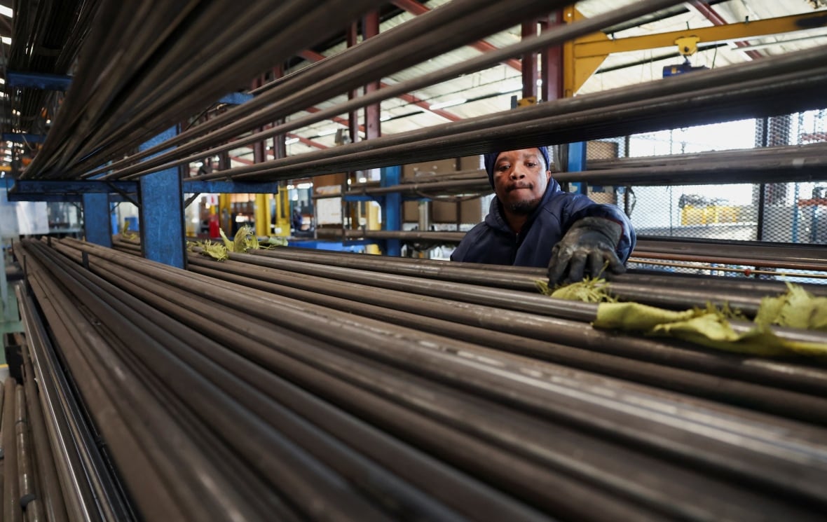 Vusi Khoza, a worker at Dynamic Fluid Control, one of Africa's largest valve manufacturers that exports valves used in mining, water, and waste infrastructure to the United States, sorts steel at the company’s facility in Benoni, east of Johannesburg, South Africa, July 28, 2025.