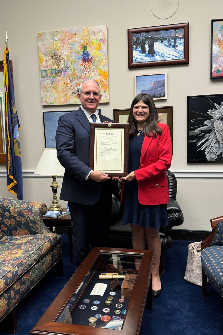 Paul Whelan with Michigan Rep. Haley Stevens being presesnted with a copy of the resolution calling for his release.