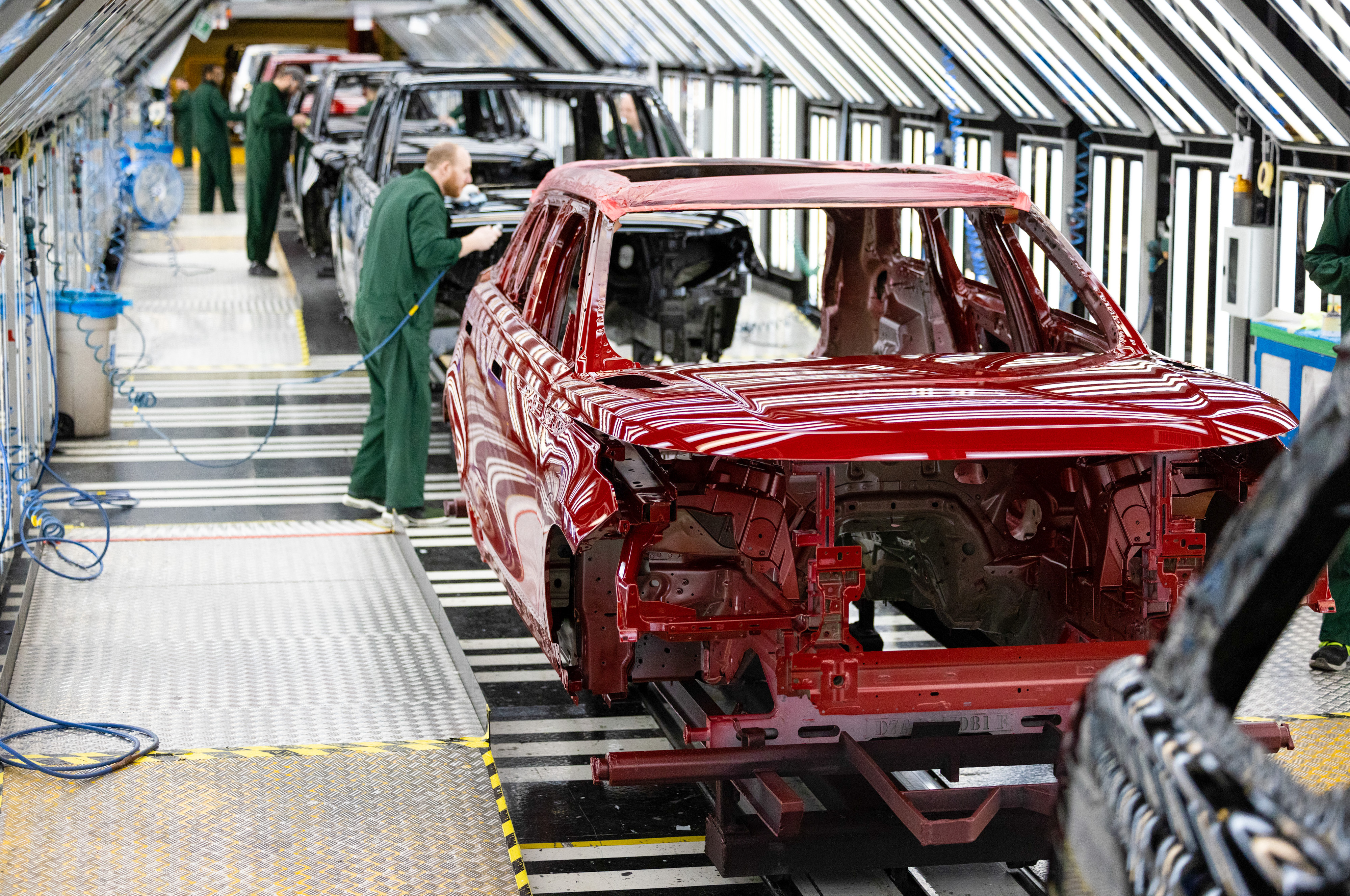 Range Rover SUVs being assembled in the paint shop at the Jaguar Land Rover vehicle manufacturing plant in Solihull, UK.