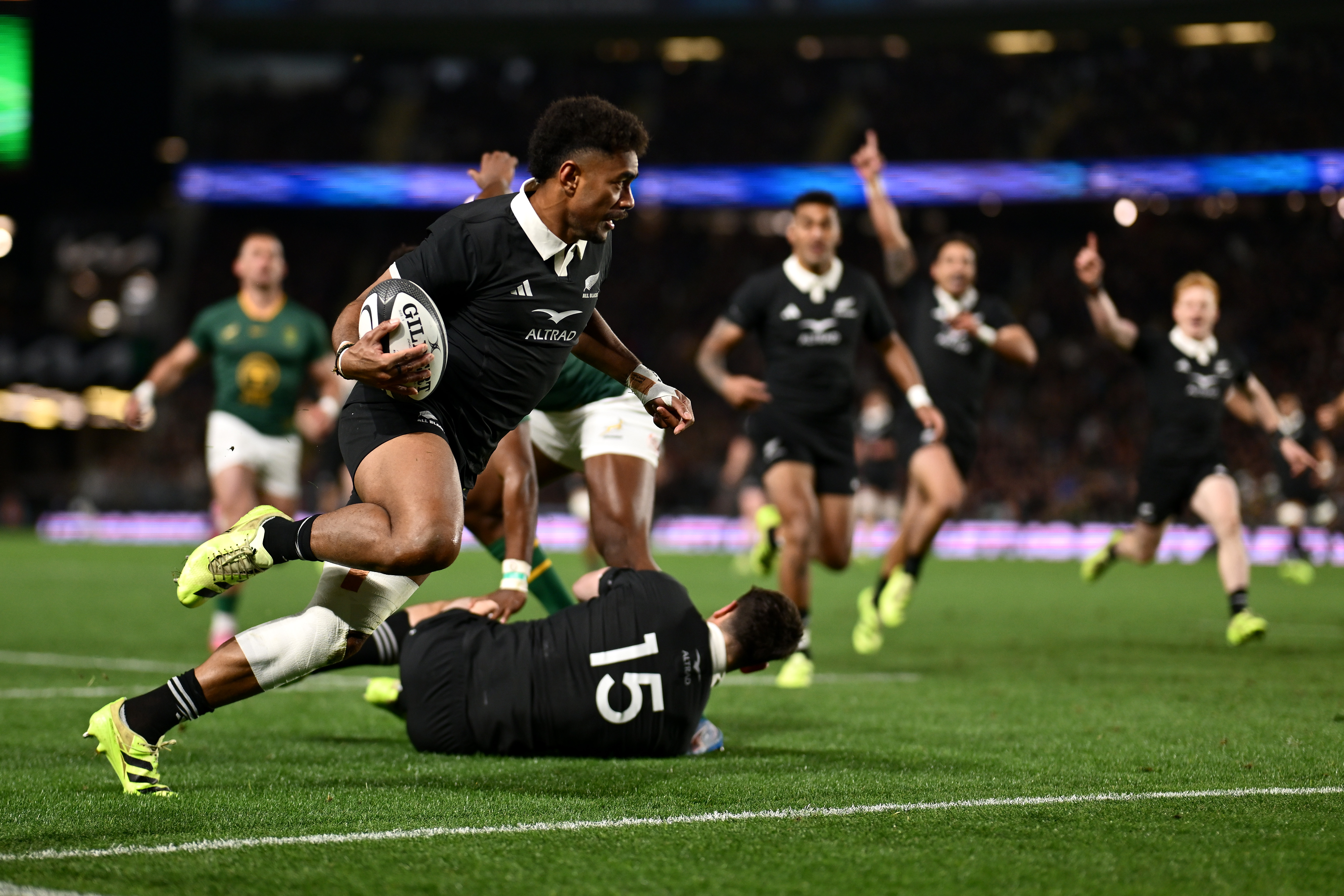 Emoni Narawa of the New Zealand All Blacks scoring a try.