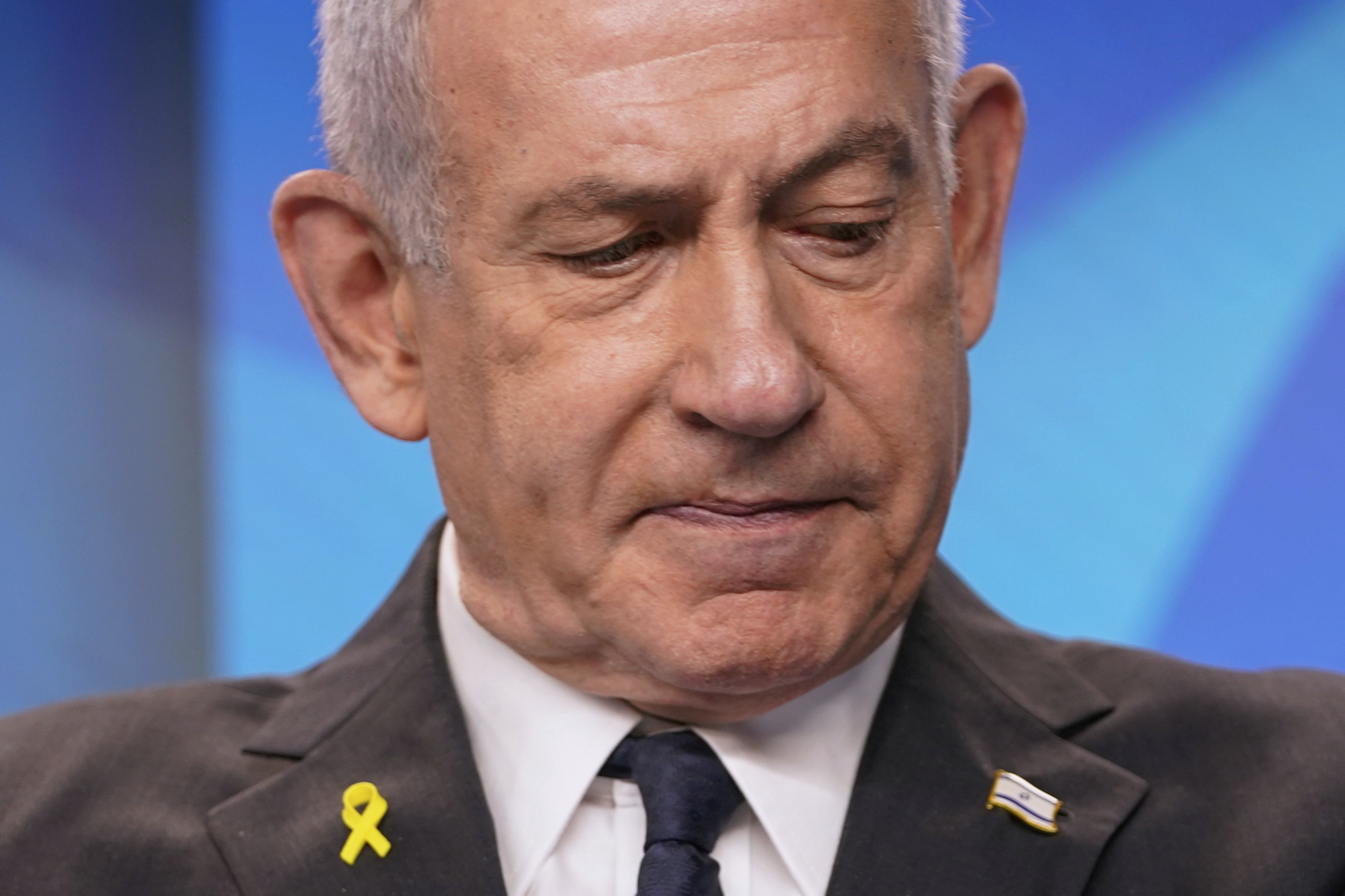 Close-up of Benjamin Netanyahu at a press conference.