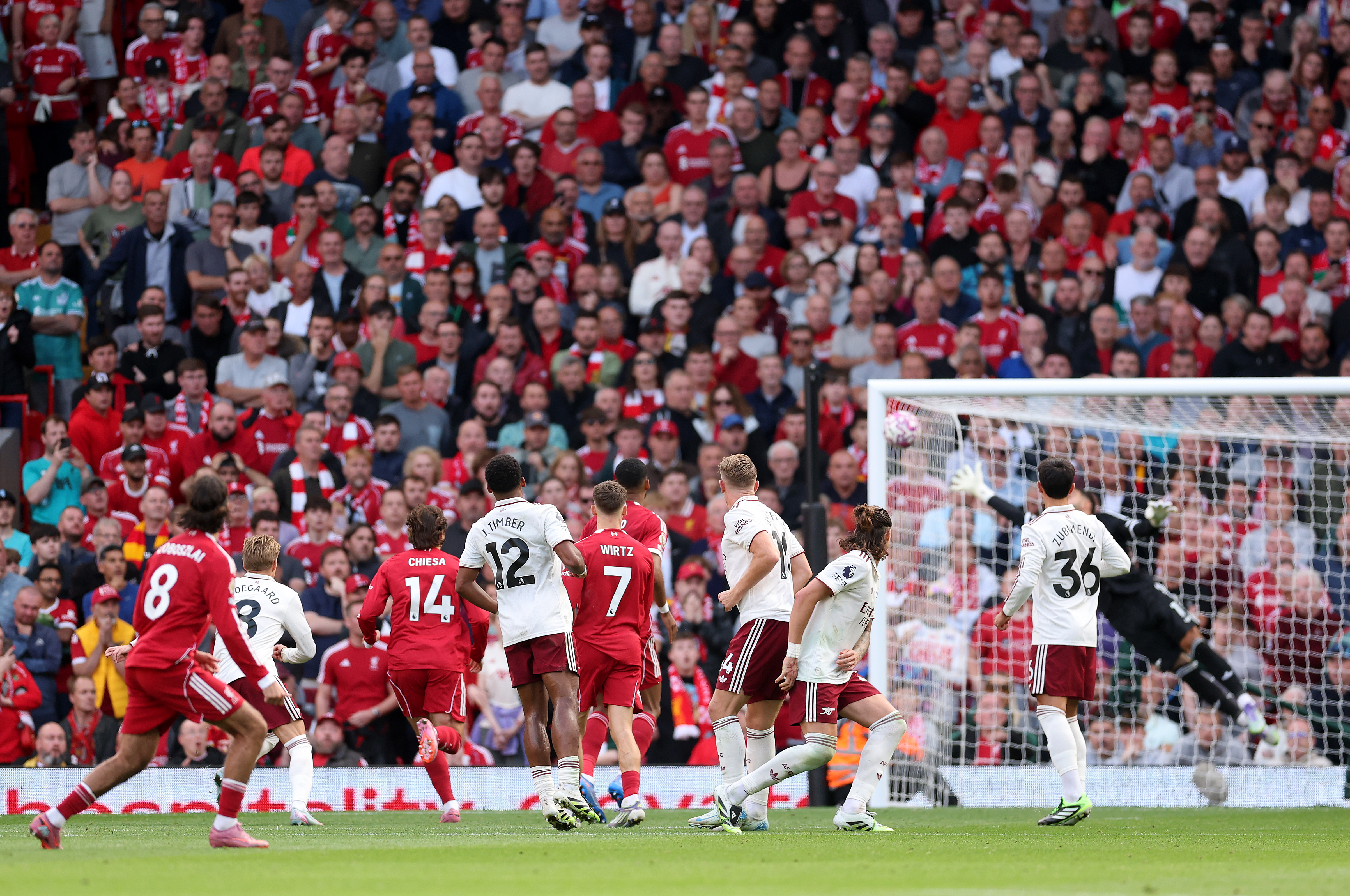 Dominik Szoboszlai of Liverpool scoring a free kick goal against Arsenal.