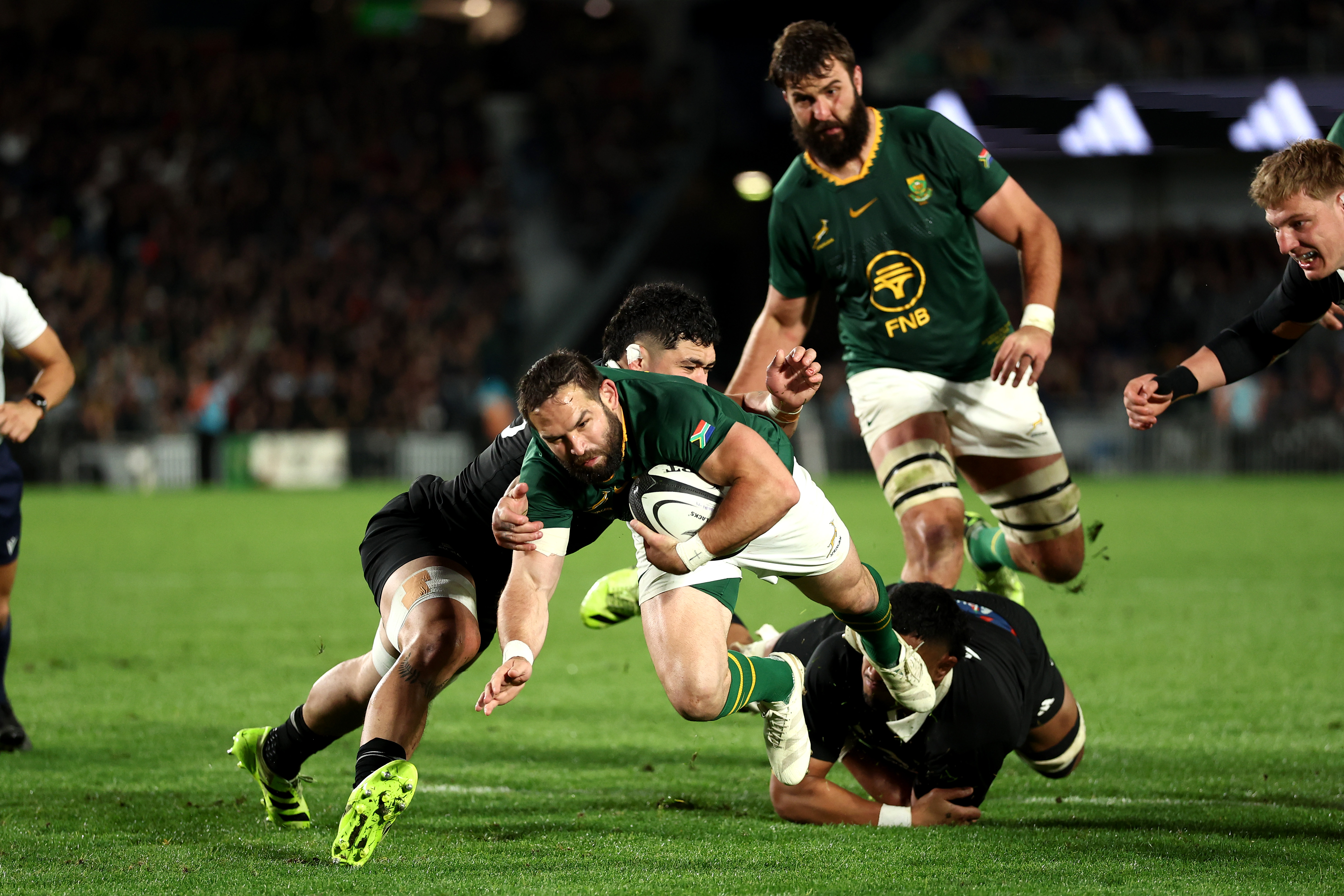 Rugby player diving for a try.
