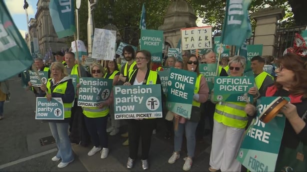 Secretaries and caretakers protest outside Government Buildings