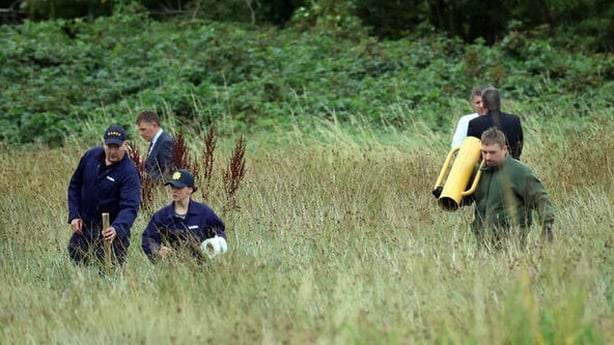 Photo show members of the gardaí at a search site in Donabate, Dublin