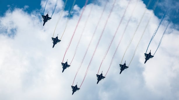 Seven J-10 aerobatic jets fly over Tiananmen Square in Beijing