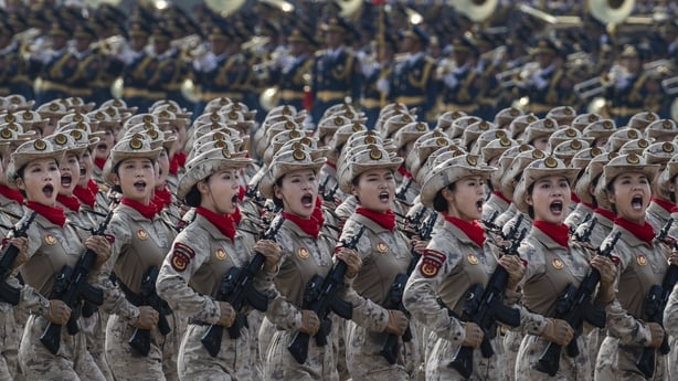 Chinese female soldiers shout as they march during a military parade marking the 80th anniversary of victory over Japan and the end of World War II, in Tiananmen Square