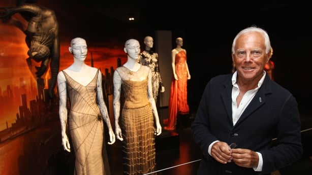 TO GO WITH AFP STORY:Entertainment-US-museum-Capes and spandex: Met explores fashionable superheroes by Paola MESSANA. Designer Giorgio Armani poses May 5, 2008 with one of his creations from 1990 (2nd L) and one from John Galliano (L) from 1997 during a preview of 
