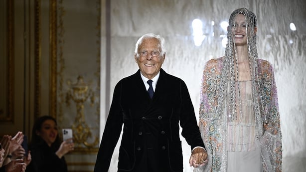 Giorgio Armani walks on fashion show catwalk