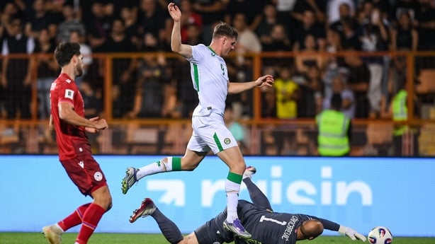 Evan Ferguson of Republic of Ireland is tackled by Armenia goalkeeper Ognjen Chancharevich during the FIFA World Cup 2026 Group F qualifying match between Armenia and Republic of Ireland at Vazgen Sargsyan Republican Stadium in Yerevan, Armenia.
