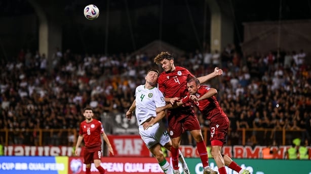 Dara O'Shea of Republic of Ireland in action against Georgii Arutiunian and Kamo Hovhannisyan of Armenia during the FIFA World Cup 2026 Group F qualifying match between Armenia and Republic of Ireland at Vazgen Sargsyan Republican Stadium in Yerevan, Armenia.