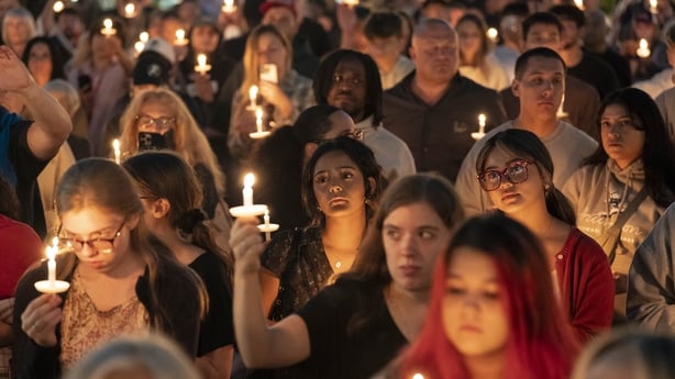 Attendees hold candles during a candlelight vigil and prayer event for Turning Point USA Founder Charlie Kirk on September 10, 2025 in Seattle, Washington. Kirk was shot dead while speaking at Utah Valley University earlier in the day. (Photo by David Ryder/Getty Images)