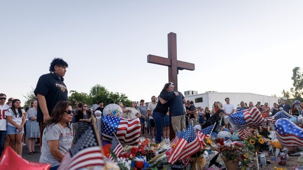 PHOENIX, ARIZONA - SEPTEMBER 12: People visit a memorial for Charlie Kirk at the Turning Point USA headquarters on September 12, 2025 in Phoenix, Arizona. Kirk, the CEO and co-founder of Turning Point USA, was shot and killed on Wednesday in Utah. (Photo by Eric Thayer/Getty Images)