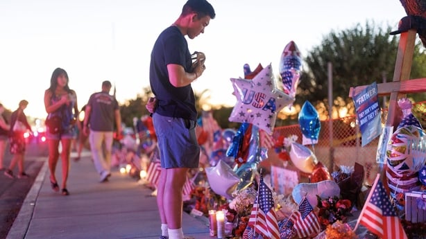 People visit a memorial for Charlie Kirk at the headquarters of Turning Point USA 