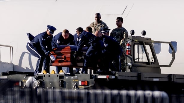 The casket containing the body of Charlie Kirk is removed from Air Force Two at Phoenix Sky Harbor International Airport