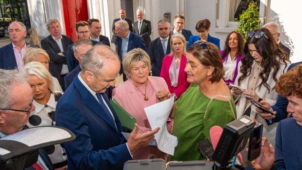 Antoinette Burke (right), mother of Katie Burke from Cobh, confronts Taoiseach Micheal Martin