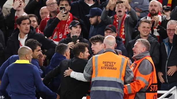 LIVERPOOL, ENGLAND - SEPTEMBER 17: Diego Simeone, Manager / Head Coach of Atletico Madrid is restrained as he confronts fans after the late Liverpool winning goal during the UEFA Champions League 2025/26 League Phase MD1 match between Liverpool FC and Atletico de Madrid at Anfield on September 17, 2