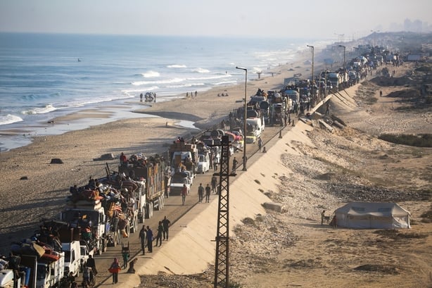 TOPSHOT - Displaced Palestinians move with their belongings southwards on a road in the Nuseirat refugee camp area in the central Gaza Strip following renewed Israeli evacuation orders for Gaza City on September 18, 2025. Israel has announced a major ground assault in Gaza City that it says is aimed