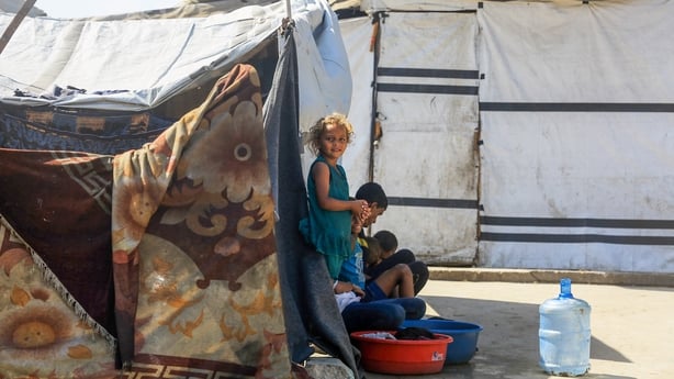 Palestinian families displaced from northern Gaza have taken shelter in a UNRWA school,