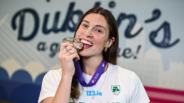 24 September 2025; Kate O'Connor of Ireland poses with her heptathlon silver medal at Dublin Airport following her return from the 2025 World Athletics Championships in Tokyo, Japan. Photo by Seb Daly/Sportsfile