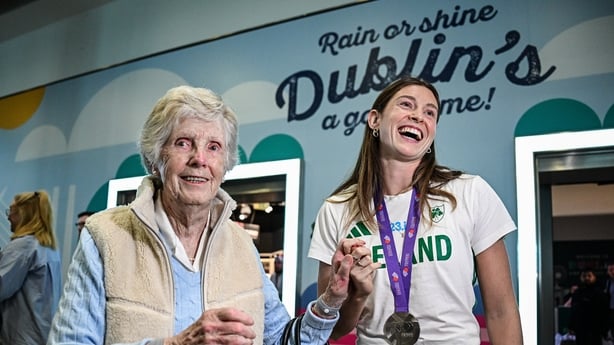 24 September 2025; Kate O'Connor of Ireland is greeted by her grandmother Madeline at Dublin Airport following her return from the 2025 World Athletics Championships in Tokyo, Japan. Photo by Seb Daly/Sportsfile