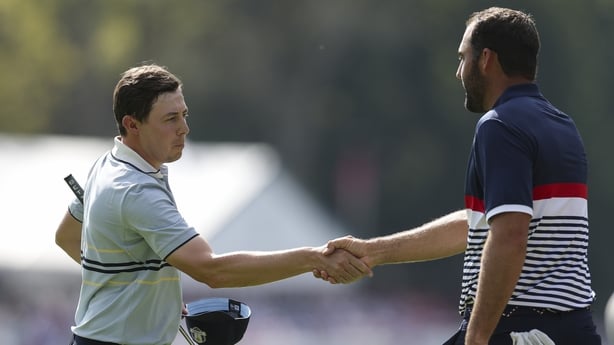 Matt Fitzpatrick of Team Europe and Scottie Scheffler of Team United States shake hands on the 15th green following a Team Europe 5&3 victory during the Friday morning foursomes matches of the 2025 Ryder Cup at Black Course at Bethpage State Park Golf Course on September 26, 2025 in Farmingdale, New