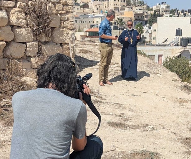 Fr David Khoury is interviewed by RTE editor Tony Connelly in Taybeh in the West Bank 