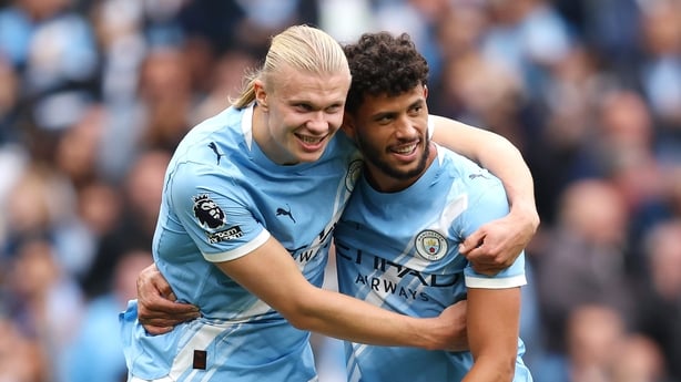 Erling Haaland of Manchester City celebrates scoring his team's fifth goal with teammate Matheus Nunes during the Premier League match between Manchester City and Burnley at Etihad Stadium on September 27, 2025 in Manchester, England.