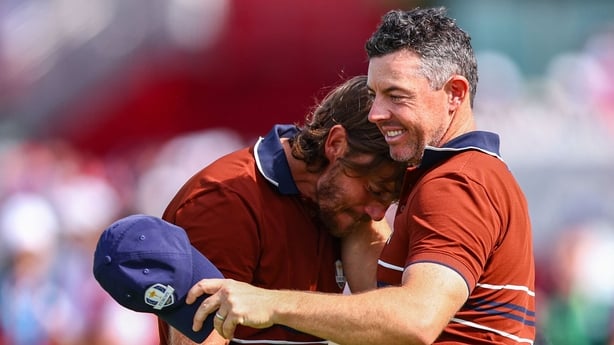 27 September 2025; Rory McIlroy of Europe, right, and Tommy Fleetwood of Europe celebrate after the morning foursomes on day two of the 2025 Ryder Cup at Black Course at Bethpage State Park Golf Course in Farmingdale, New York, USA. Photo by Vaughn Ridley/Sportsfile