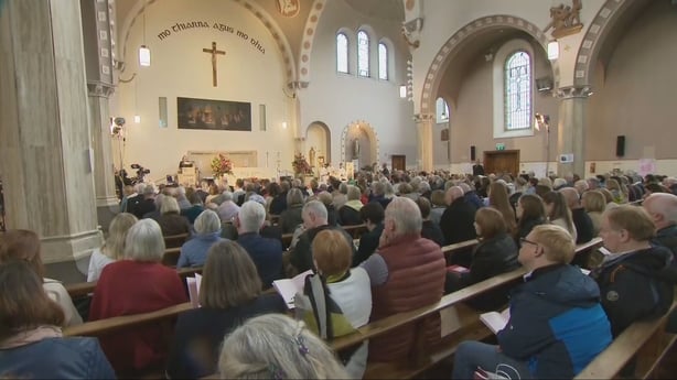 People attend a service in honour of organ donors