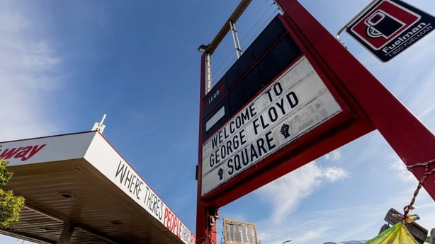 A sign at the gas station at George Floyd Square