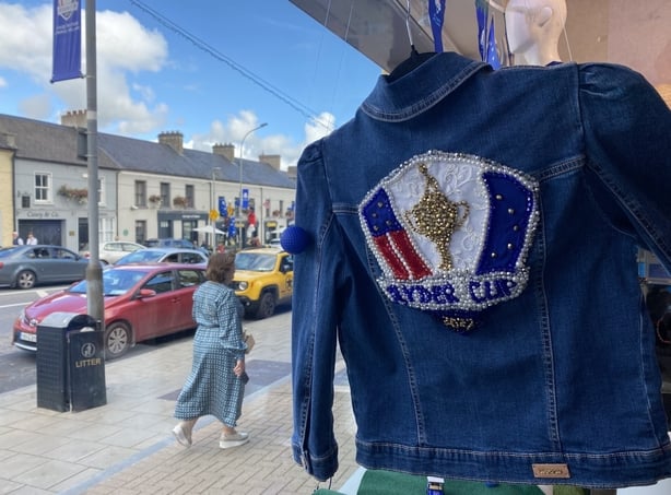 Denim jacket with a Ryder Cup branding hanging in a shop window