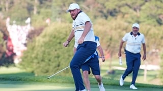 FARMINGDALE, NEW YORK - SEPTEMBER 28: Shane Lowry of Team Europe makes his putt to halve the hole and retain the Ryder Cup on the 18th green during the Sunday singles matches of the 2025 Ryder Cup at Black Course at Bethpage State Park Golf Course on Sept