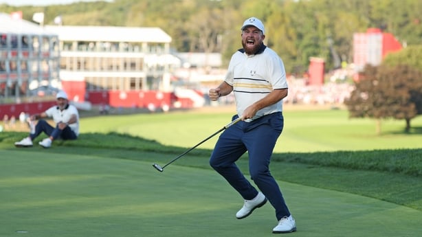 FARMINGDALE, NEW YORK - SEPTEMBER 28: Shane Lowry of Team Europe celebrates after his putt to halve the hole and retain the Ryder Cup on the 18th green during the Sunday singles matches of the 2025 Ryder Cup at Black Course at Bethpage State Park Golf Course on September 28, 2025 in Farmingdale, New