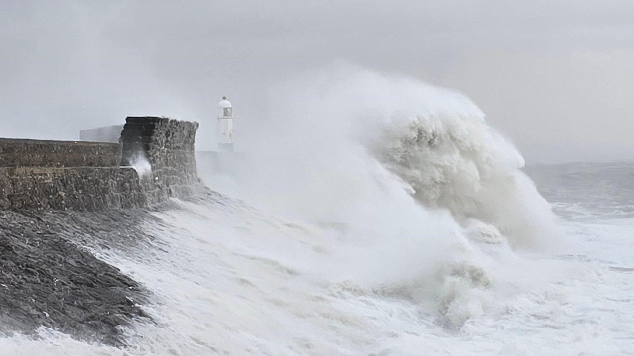 A photo of large waves hitting the coast