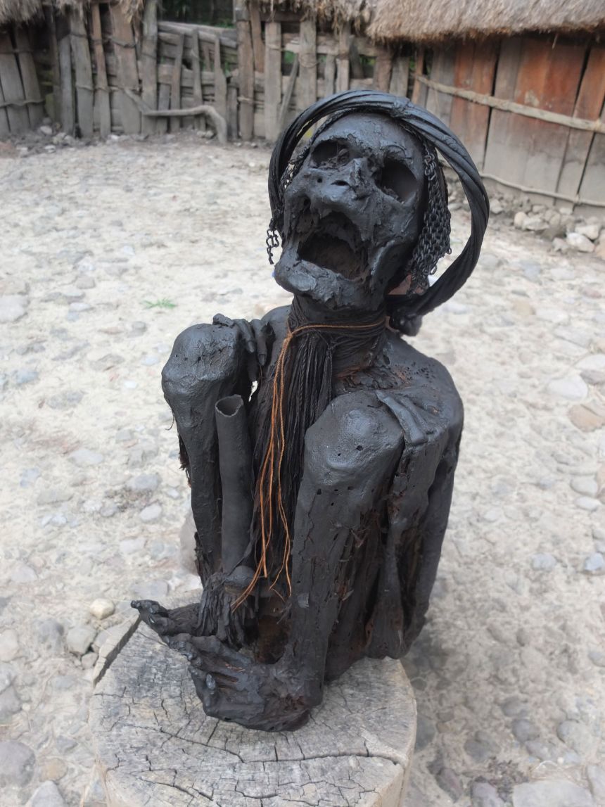 Based on similar mummification practices in modern Papua New Guinea, seen here in a Dani skeleton, the study authors propose that people thousands of years ago prepared their dead by smoke-drying the remains.