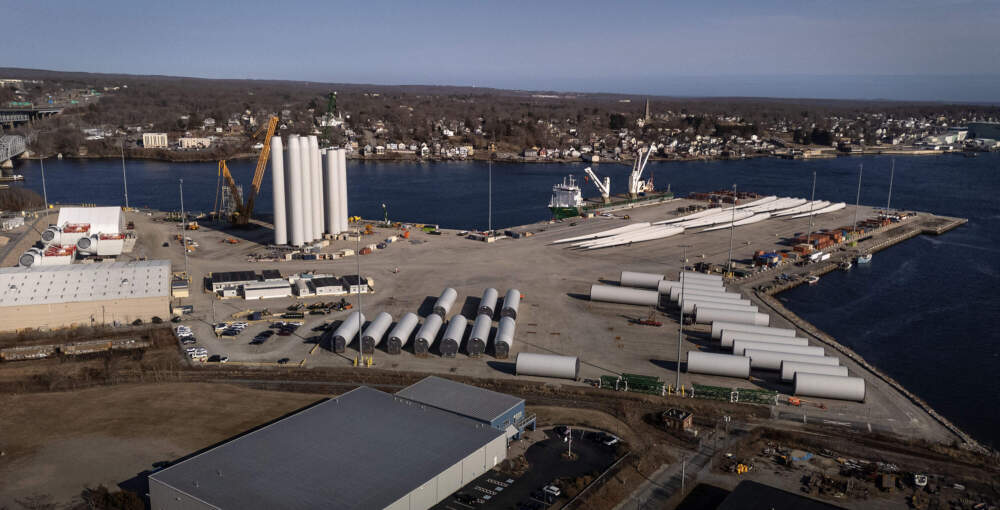 Sections of wind turbines wait to be moved out to sea at the Connecticut Port Authority's New London State Pier Terminal. (Robin Lubbock/WBUR)