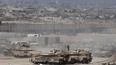 EPA Israeli tanks deployed in southern Israel, near the Gaza perimeter fence (2 September 2025)