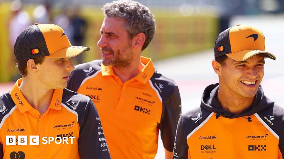 Oscar Piastri and Lando Norris having a conversation after the Italian Grand Prix, with McLaren team boss Andrea Stella stood behind them