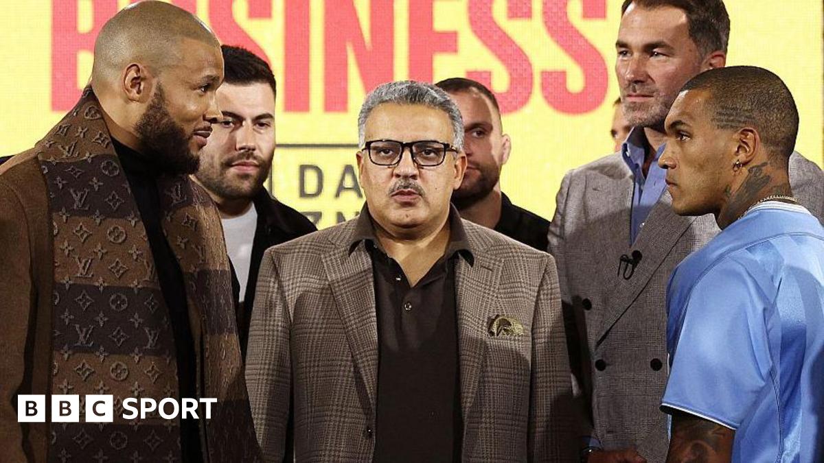 Chris Eubank Jr smirks at Conor Benn during a face-off